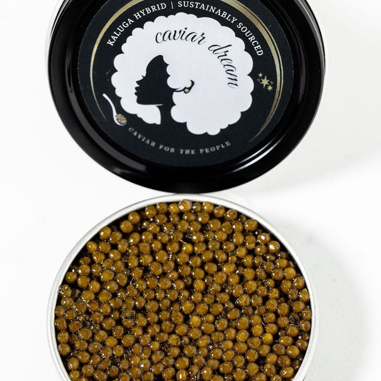 Kaluga Hybrid caviar in a black container with 'Caviar Dream' branding on a white background