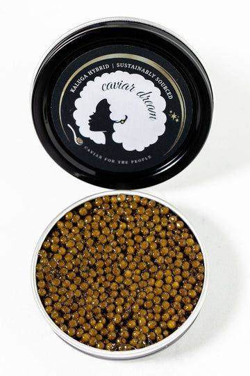 Kaluga Hybrid caviar in a black container with 'Caviar Dream' branding on a white background