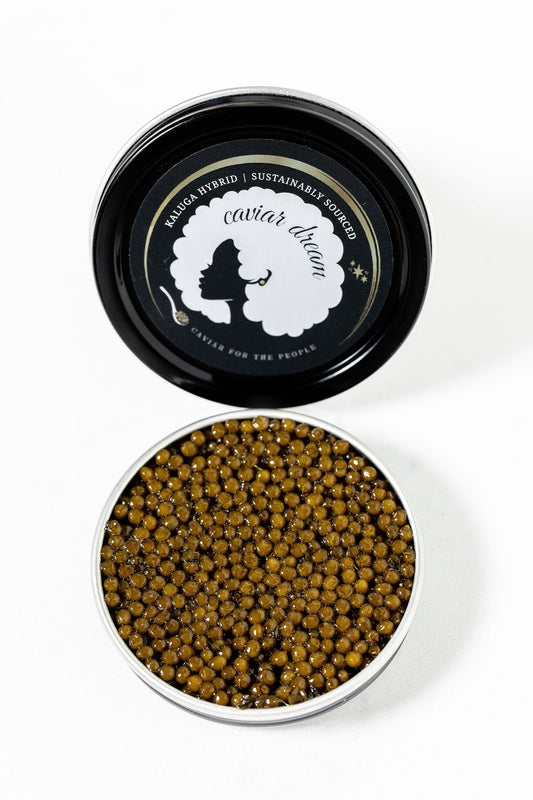 Kaluga Hybrid caviar in a black container with 'Caviar Dream' branding on a white background