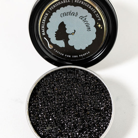 Caviar Dream Hackleback caviar tin open to display luscious black caviar